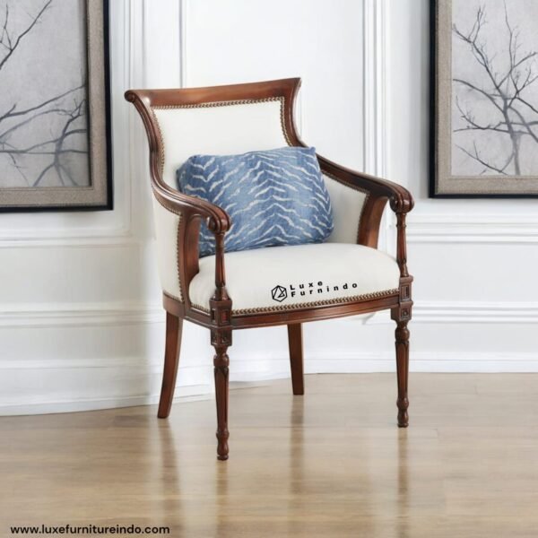 Classic vintage solid wood armchair with white upholstery and elegant backrest.