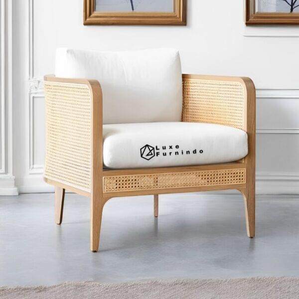 Scandinavian-style lounge chair with rattan back, natural wood frame, and cream cushion -- Indonesia Furniture.