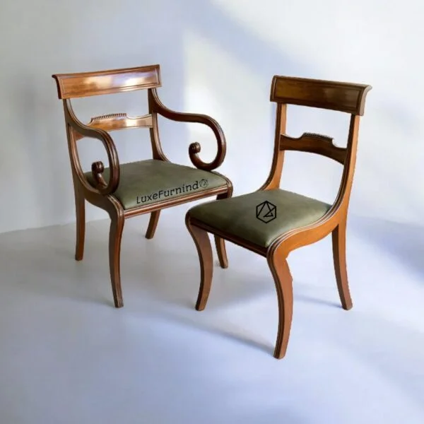 Set of two retro-style dining chairs with mahogany finish, one with armrest, green upholstered seats