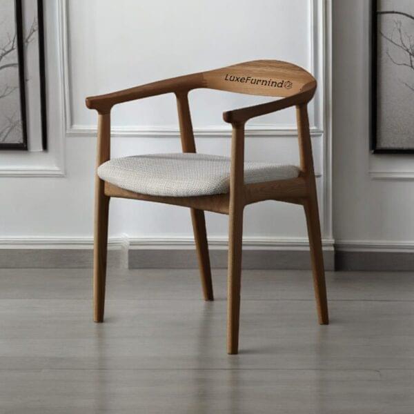 Scandinavian-style wooden armchair with curved backrest and upholstered seat, handcrafted in Indonesia - Indonesia Furniture Supplier